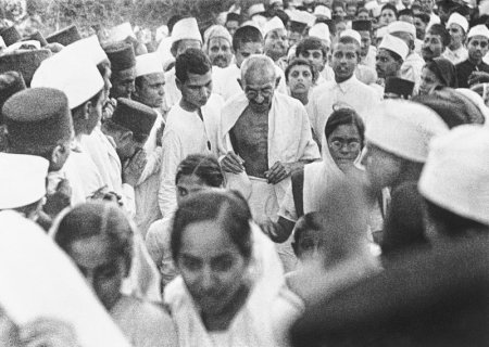 Gandhiji at the Dandi , Gujarat Salt March. Surrounded by adoring crowds, the end of the British Raj came in sight. (Image source - Associated Press File; Courtesy - pressherald.com ).